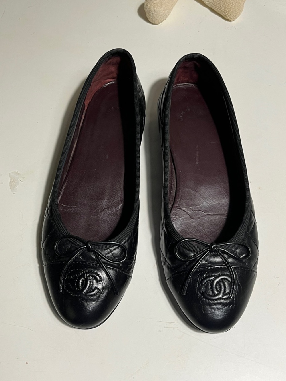 CHANEL Black Quilted Leather Ballet Flats with CC Logo Bow